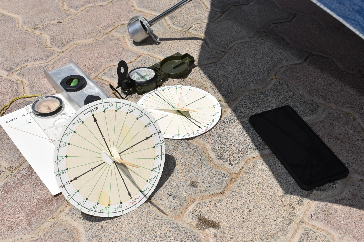 10:59am local time on phone; 14-min delay based on longitude and Greenwich meridian data so sundials should read 10:45